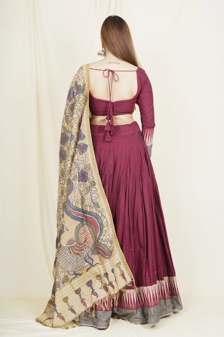 maroon-mangalagiri-cotton-lehenga-with-brown-temple-border-paired-with-matching-blouse-and-brown-pen-kalamkari-dupatta-s?uid=1675052096