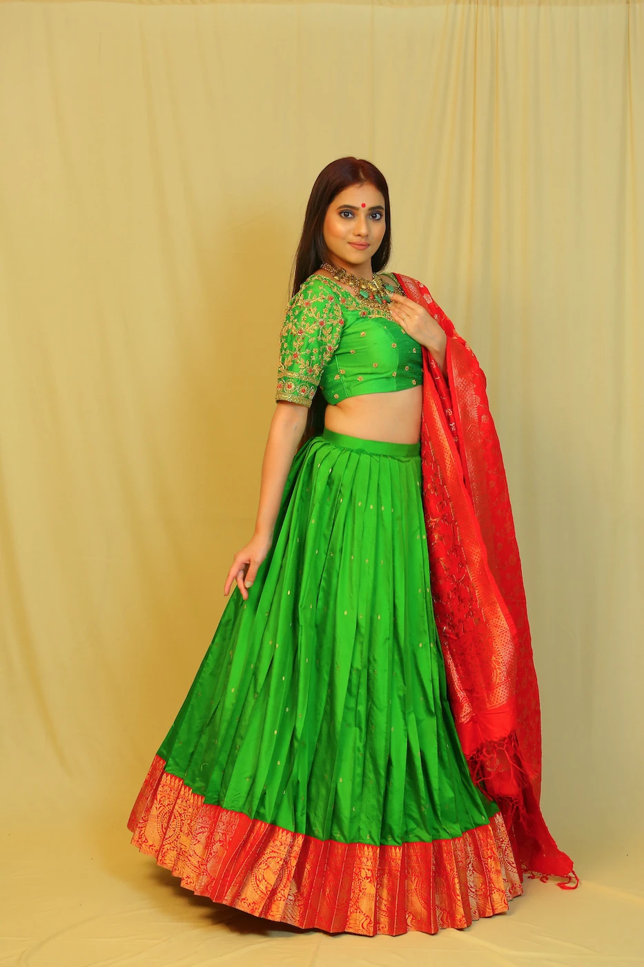 leaf-green-kanchi-silk-lehenga-with-red-border-green-silk-blouse-with-all-over-hand-embroidery-and-red-pure-benaras-silk-dupatta-m?uid=1676350485
