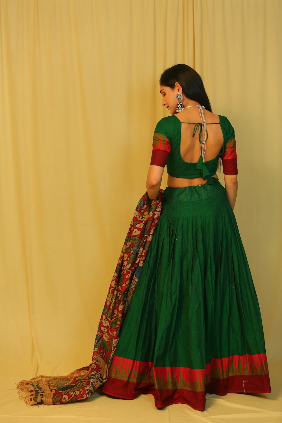 emerald-green-mangalagiri-cotton-lehenga--blouse-with-maroon-temple-border-and-red-pen-kalamkari-dupatta-s?uid=1676349365